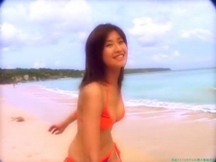 Chisato Morishita frolicking on the beach in an orange bikini003