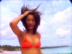 Chisato Morishita frolicking on the beach in an orange bikini016