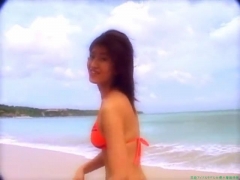 Chisato Morishita frolicking on the beach in an orange bikini022