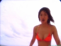 Chisato Morishita frolicking on the beach in an orange bikini027