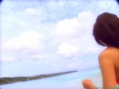 Chisato Morishita frolicking on the beach in an orange bikini035