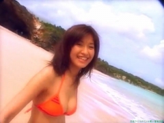 Chisato Morishita frolicking on the beach in an orange bikini067