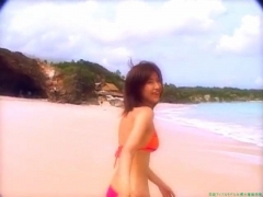 Chisato Morishita frolicking on the beach in an orange bikini068
