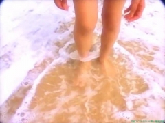 Chisato Morishita frolicking on the beach in an orange bikini077