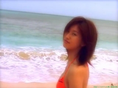 Chisato Morishita frolicking on the beach in an orange bikini082