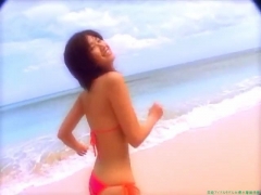Chisato Morishita frolicking on the beach in an orange bikini088